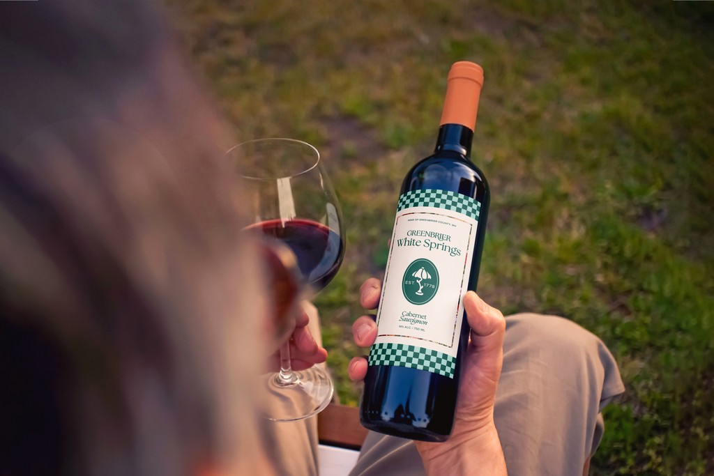 Bottle of wine, with a customized Greenbrier label.