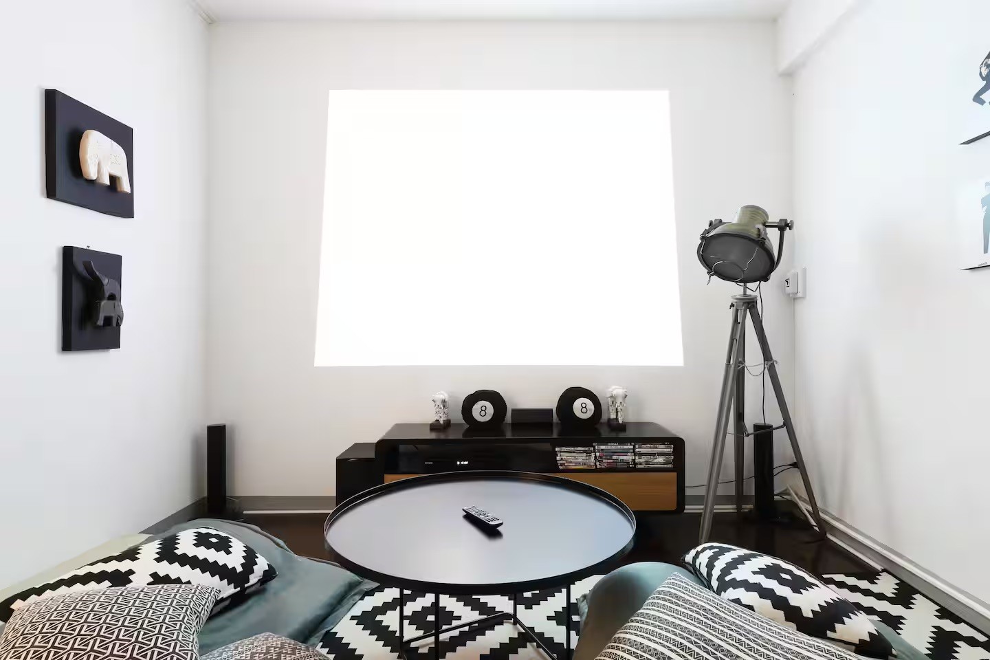 An orange cube-shaped side table is shown.