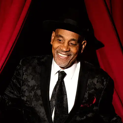 Allan Harris playing the guitar at The Django.