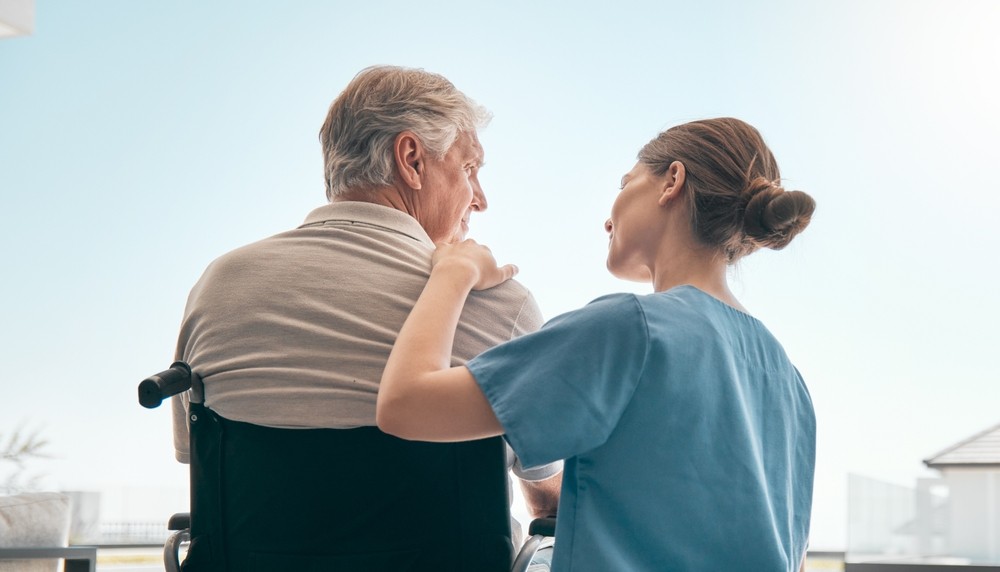 nurse helping old man