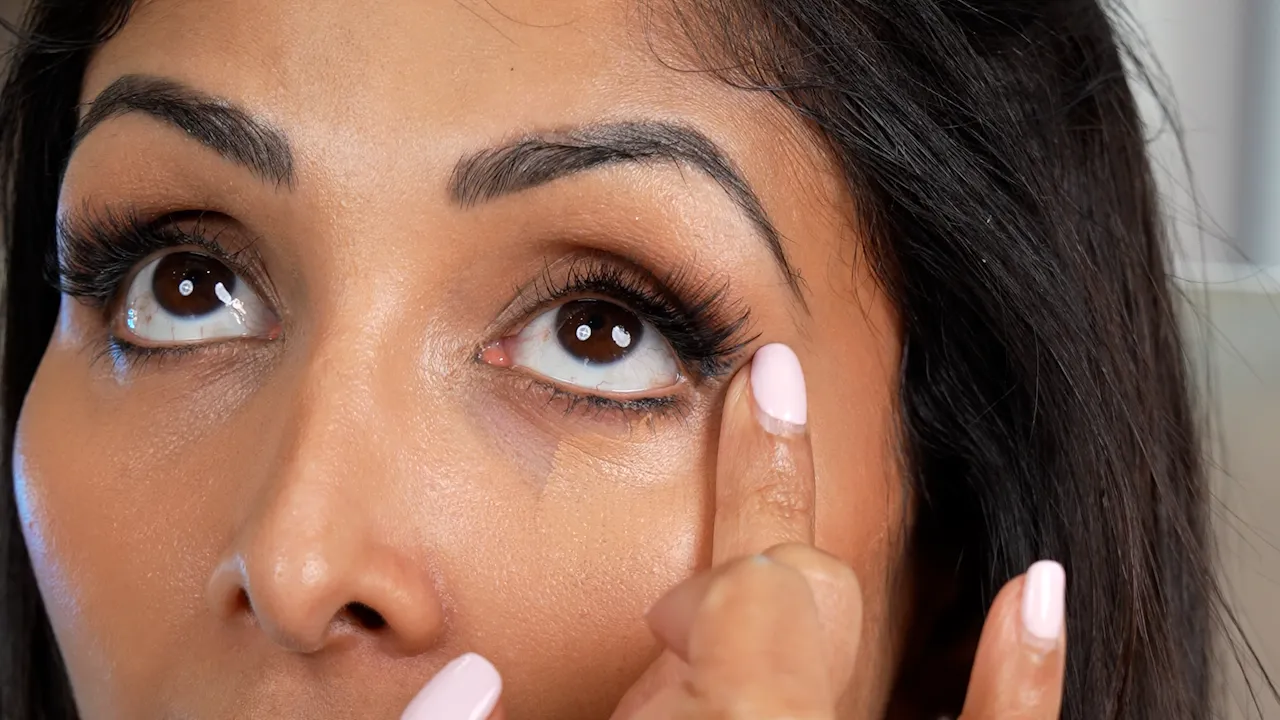 Close up skincare application filmed for a promotional Instagram ad, showing product use with precise detail and natural lighting.