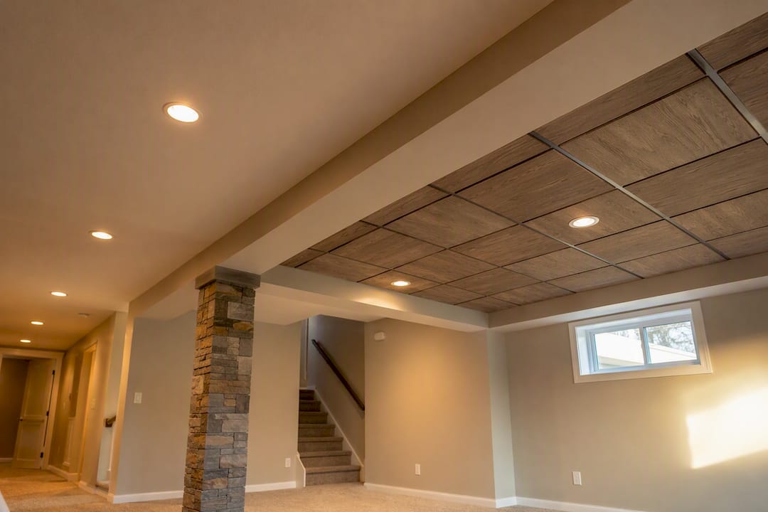 Hybrid basement ceiling mixing drywall and decorative drop ceiling tiles