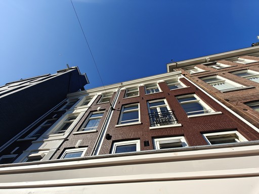 man riding bike in front of building during daytime