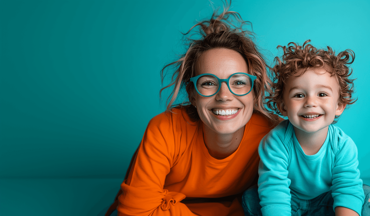 A joyful child striking a playful pose in vibrant denim, symbolizing the dynamic and enriching opportunities in United Nannies’ exceptional network.