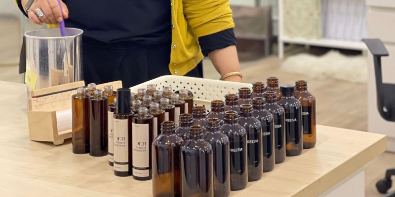 Datin Eidza, owner of 5Luxe Scents Co., mixing the scents for their reed diffusers