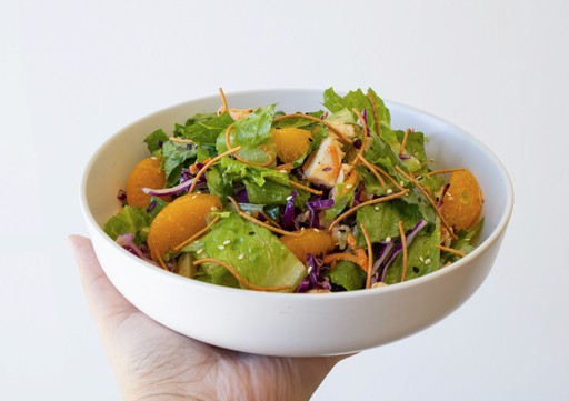 trays of california rolls and crunchy rolls