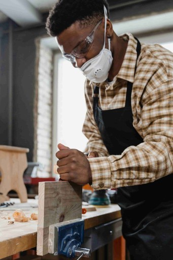 A wood-worker using tools. Showcasing how we start our projects.