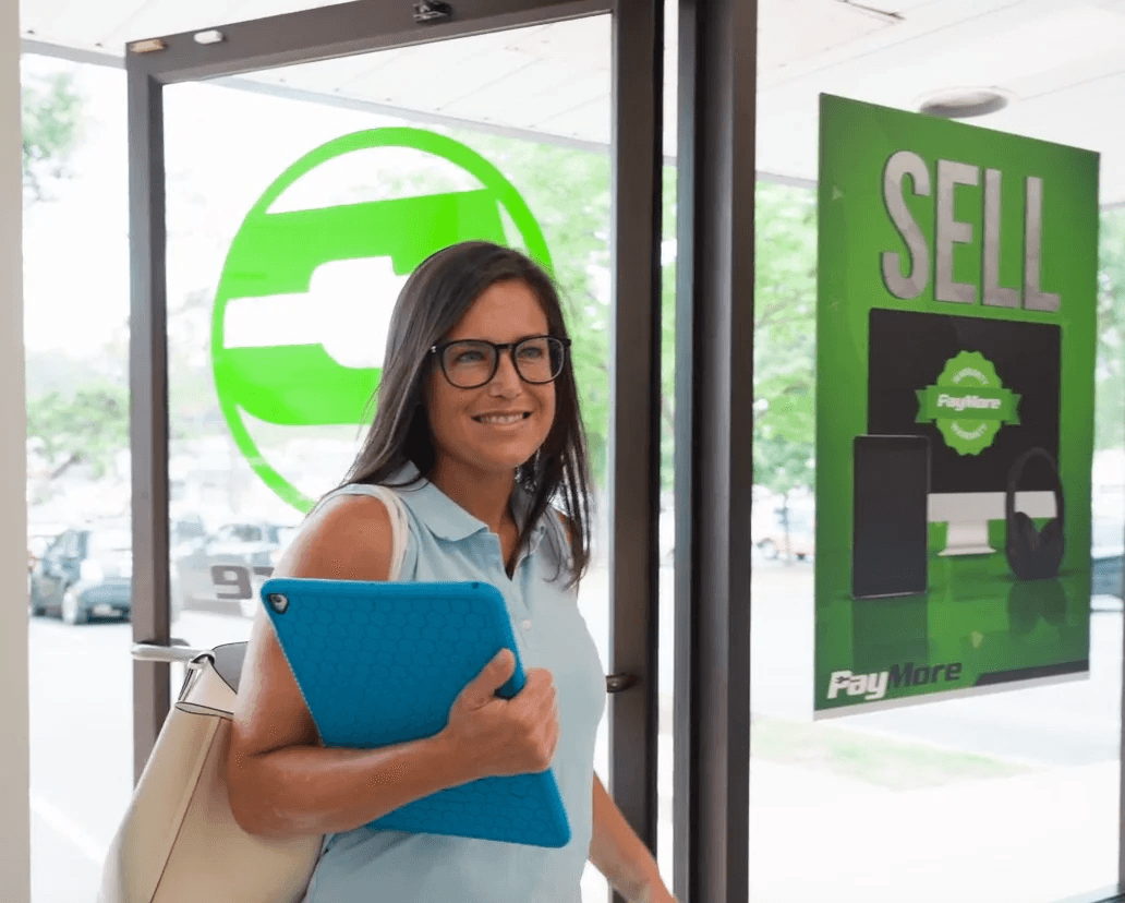 Happy customer visiting a PayMore store