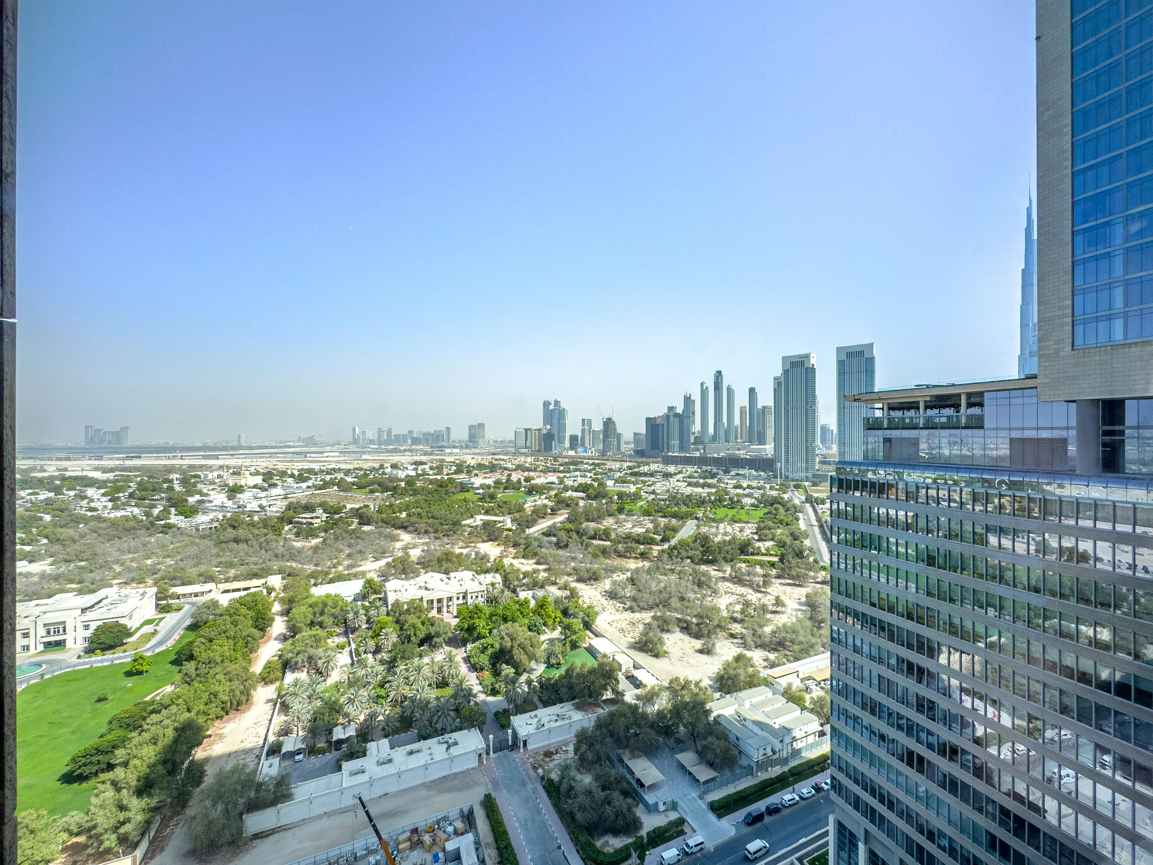 A window view on a green side of a Dubai.