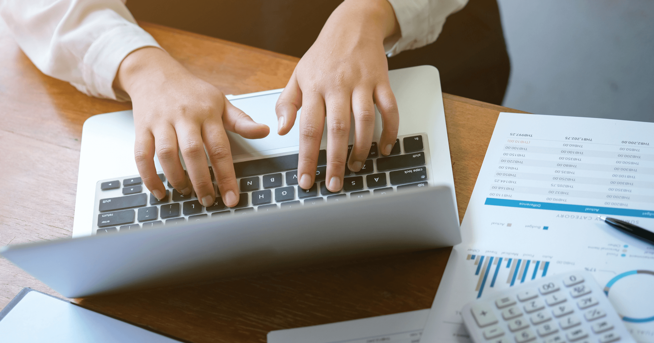 Entrepreneur calculating costs on their laptop