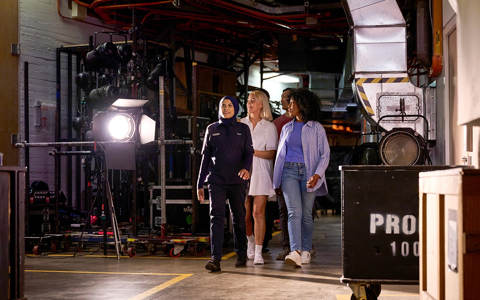 Group of tourists enjoying a Guided Back Stage Tour of Sydney Opera House, exploring the iconic architecture in Sydney, Australia
