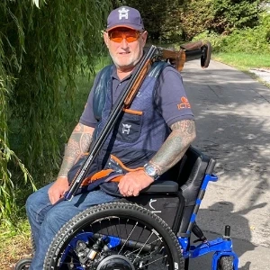Customer in his SD Motion Trike with a gun he uses for sport