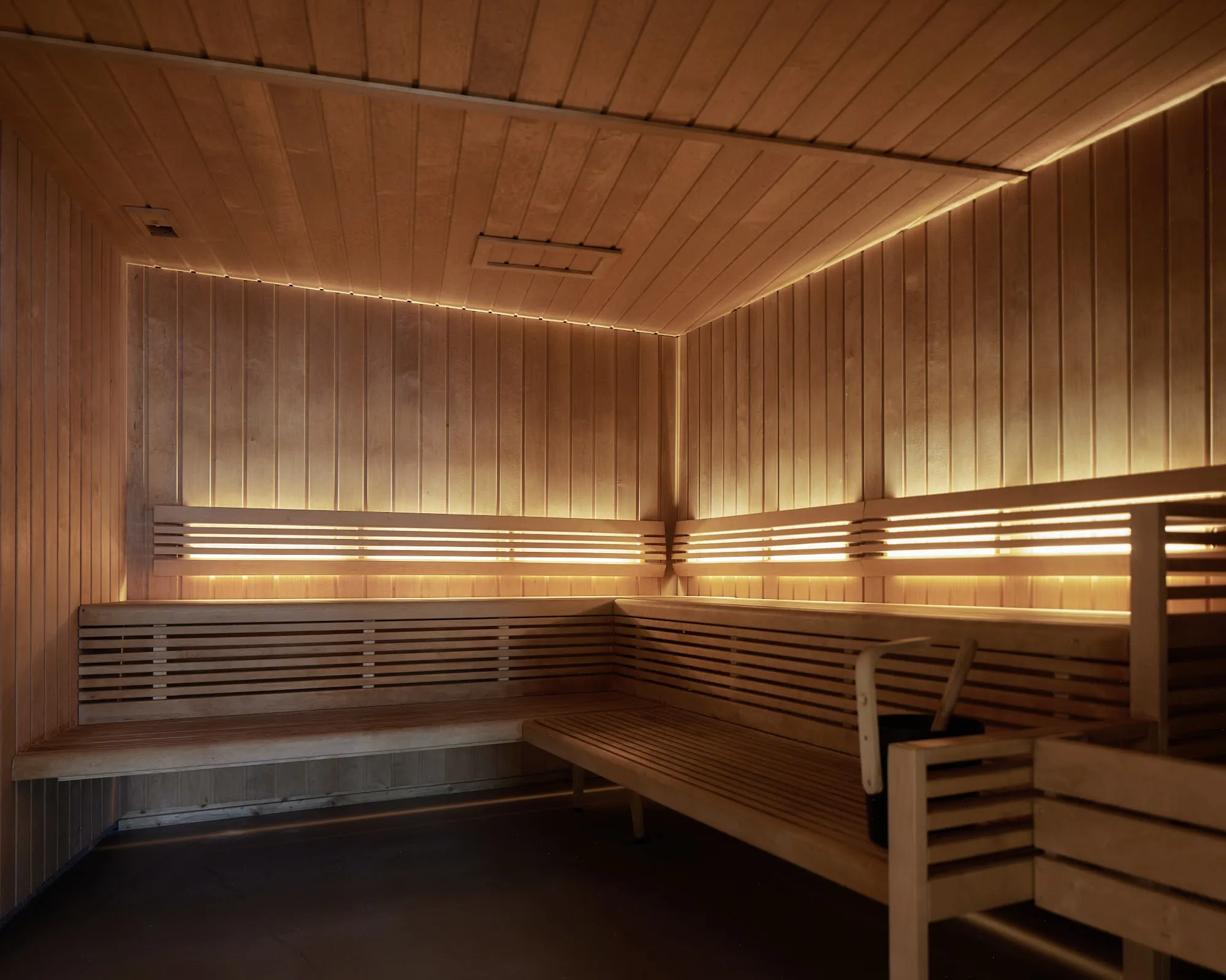 Warmly lit wooden sauna at Exeter Hotel
