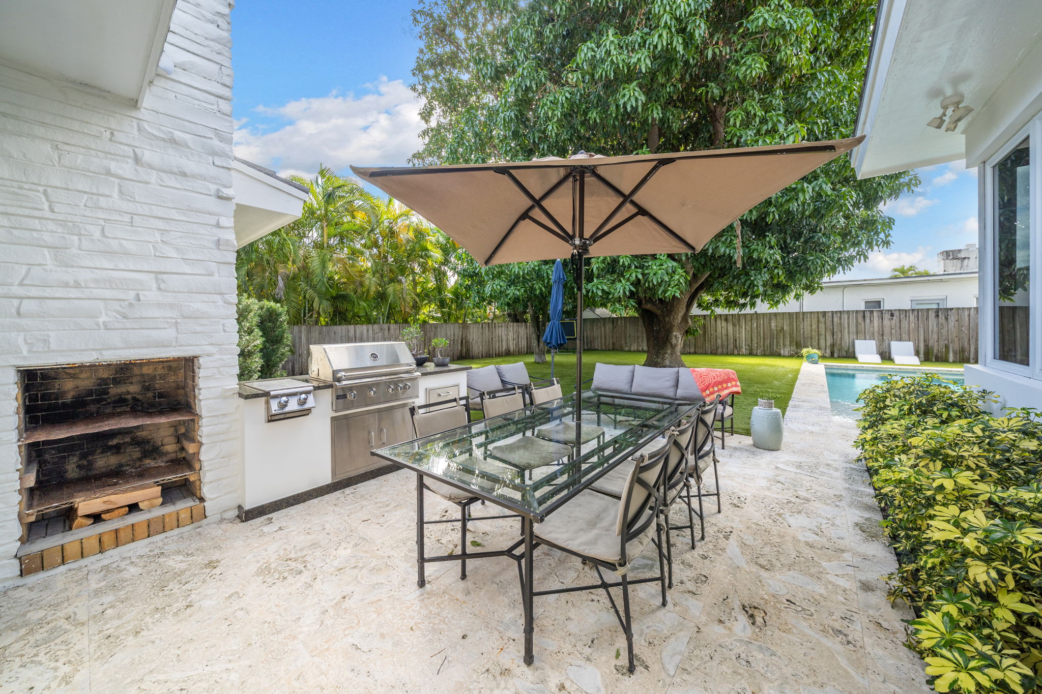 flat lay shot of spa amenities by the bathtub