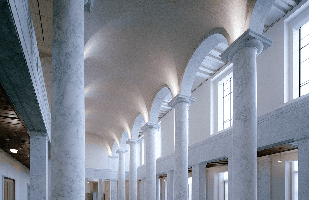 Capa de blog post da Inspira. Vista interna de um grande salão clássico com teto em arcos iluminados e imponentes colunas de mármore claro.