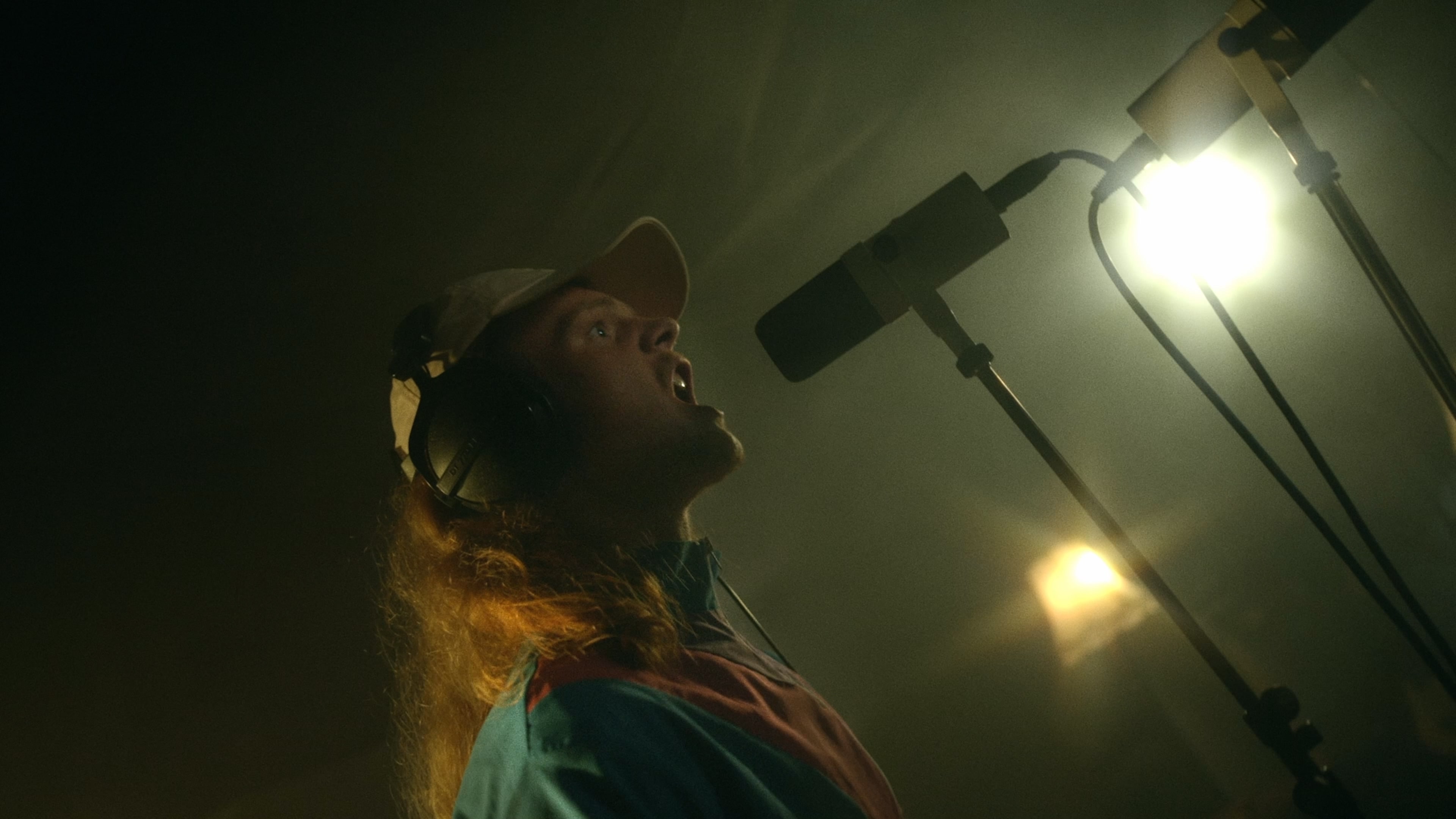 boy with mic (singing)