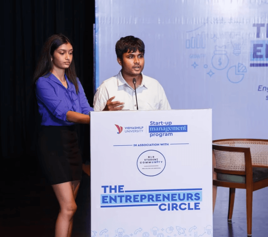 group of women in red and white dress standing on brown wooden bar during daytime