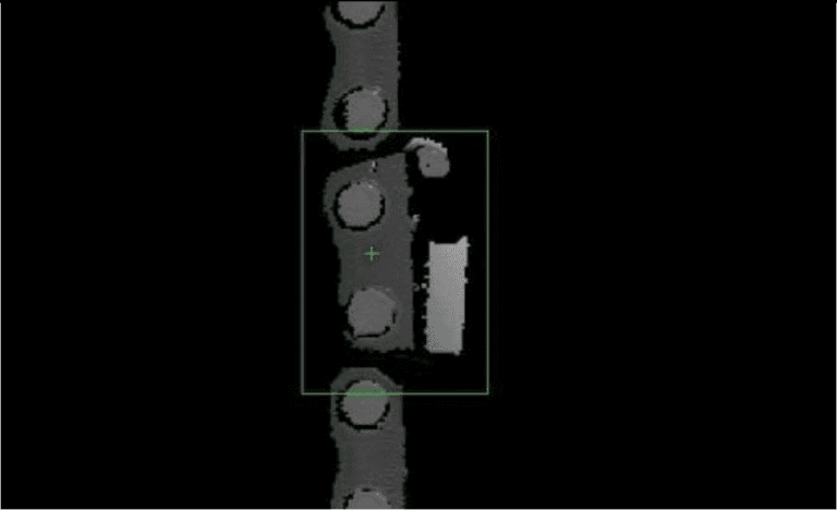 Close up image of a broken chain tooth