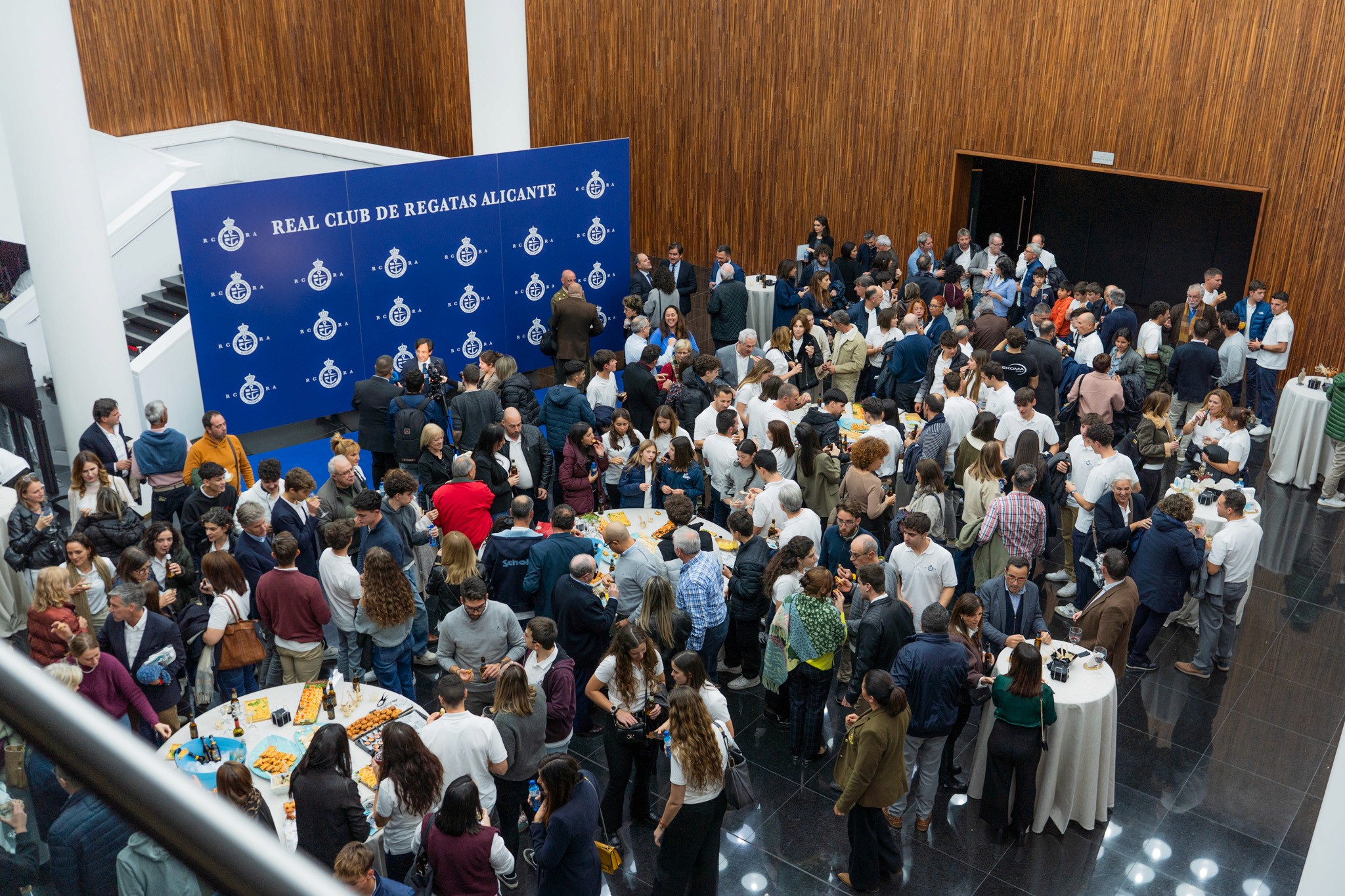 A woman with a head made of mirrors, reflecting light and creating a kaleidoscopic effect around her.