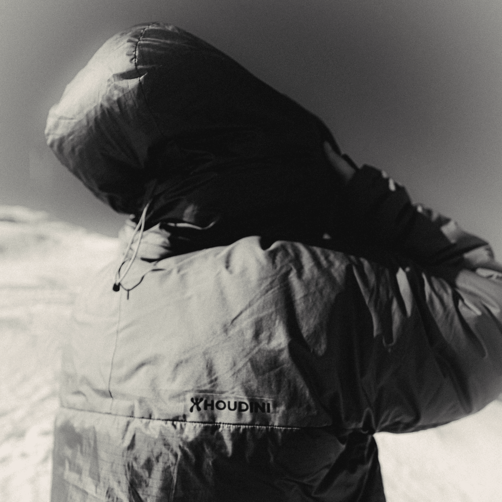 unconventional picture of a person in a big puffer jacket.