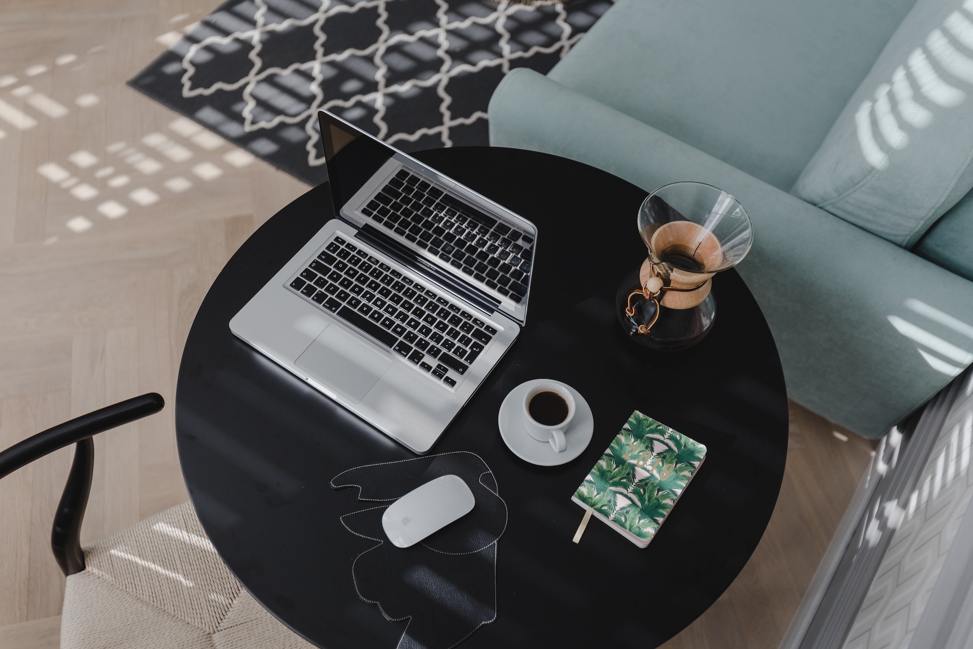 macbook, mouse, cup on the table