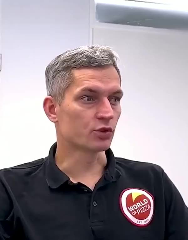 Torsten Kaldun talking in an office