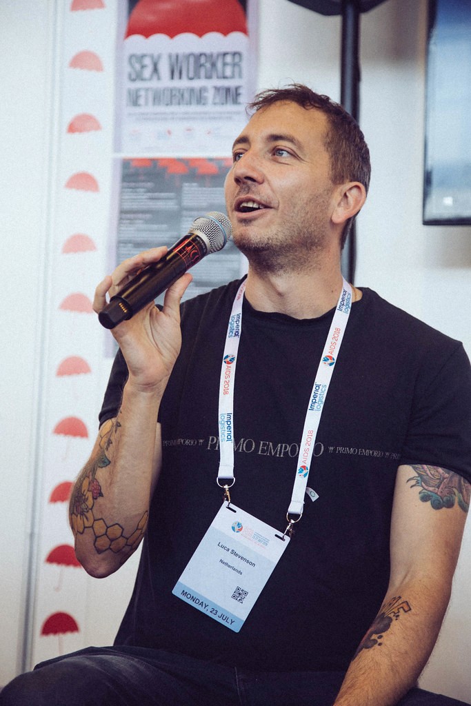 Man speaking on a microphone.