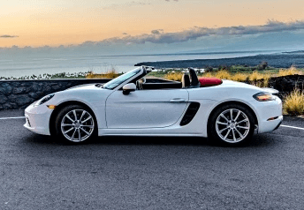 White Porsche Boxster Under Sunset Hawaii Big Island For Rent