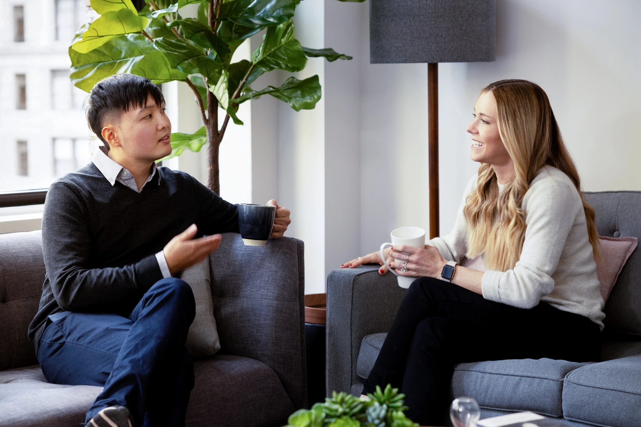 a photo of an in person therapy session being held in New York city therapy office representing inclusivity, face-to-face, support with a therapist in the same room. for a deeper sense of connection and emotional safety.