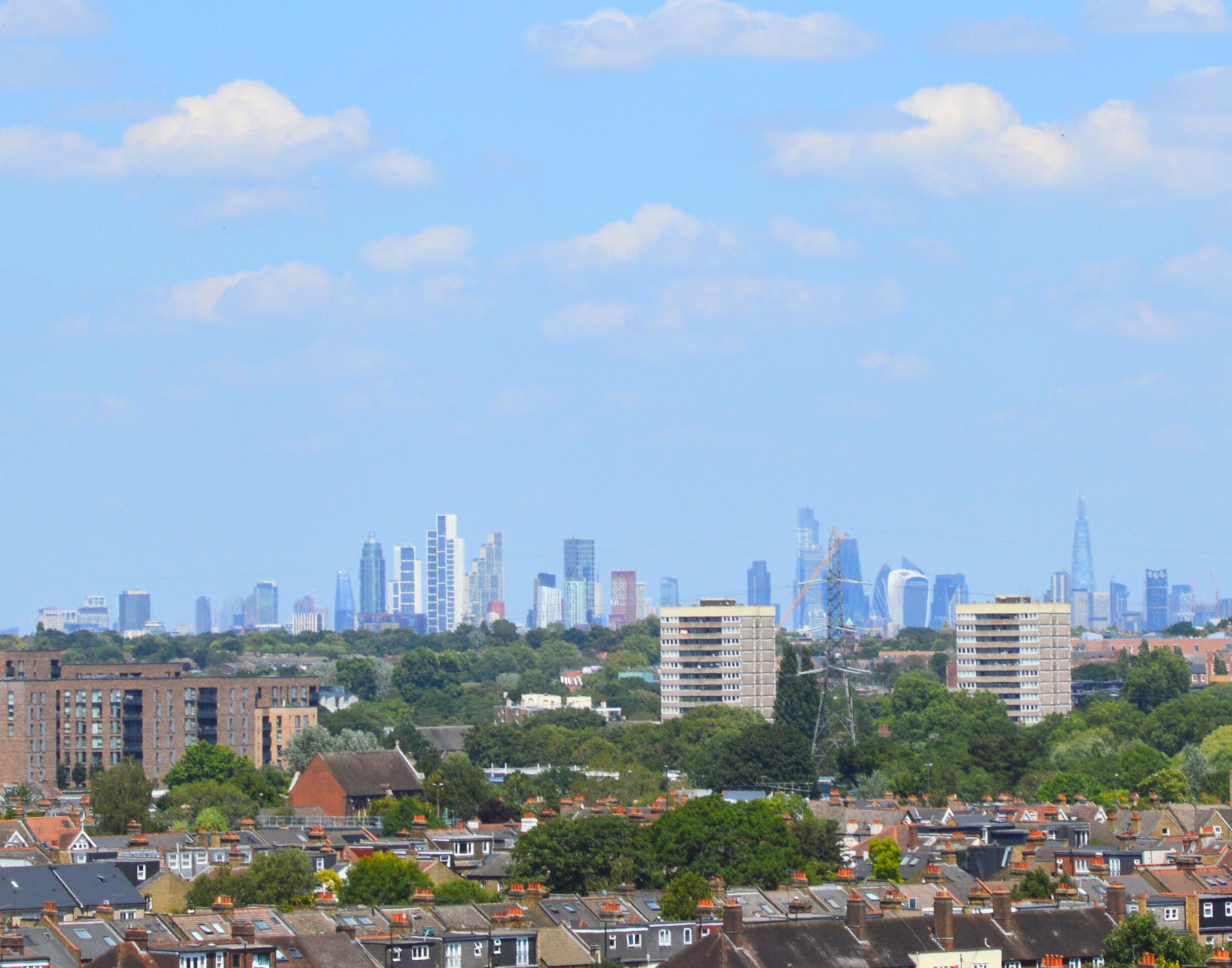 A digger inside a warehouse under construction