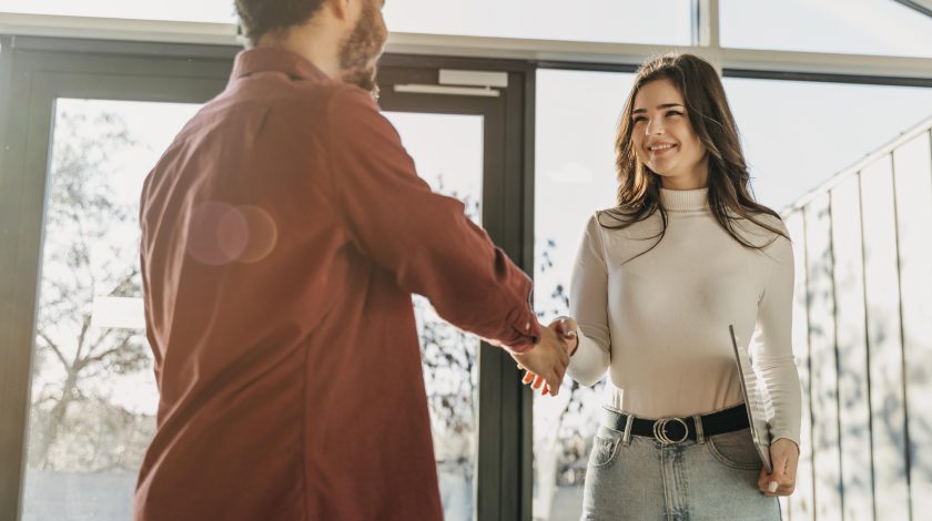 A man and a woman shaking hands