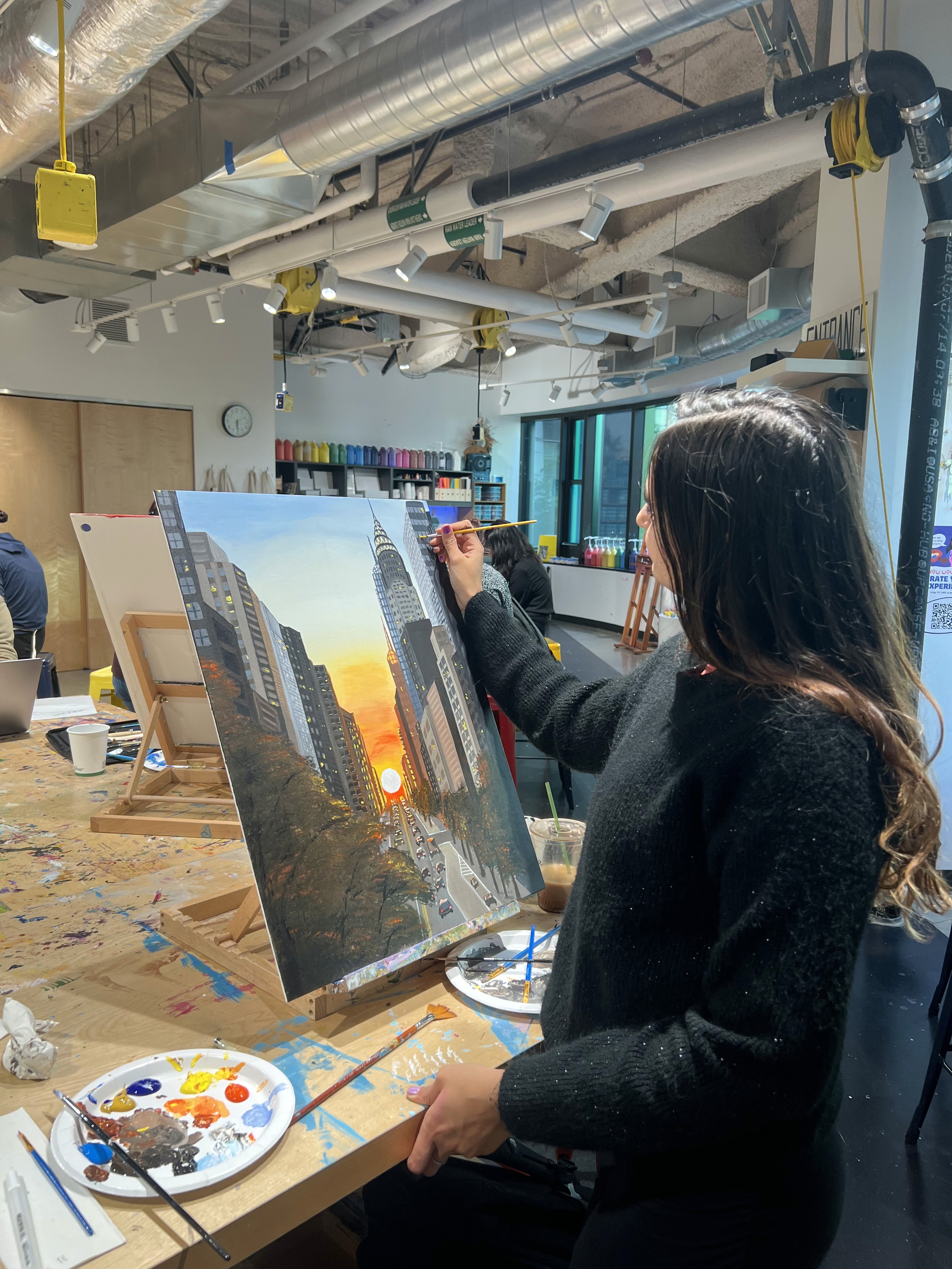 Photo of Ruchika painting on canvas