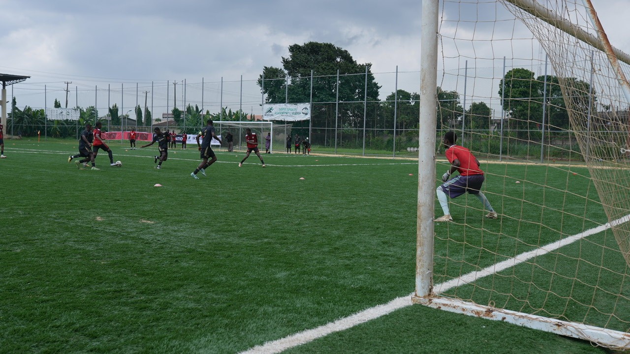 players on the pitch playing football