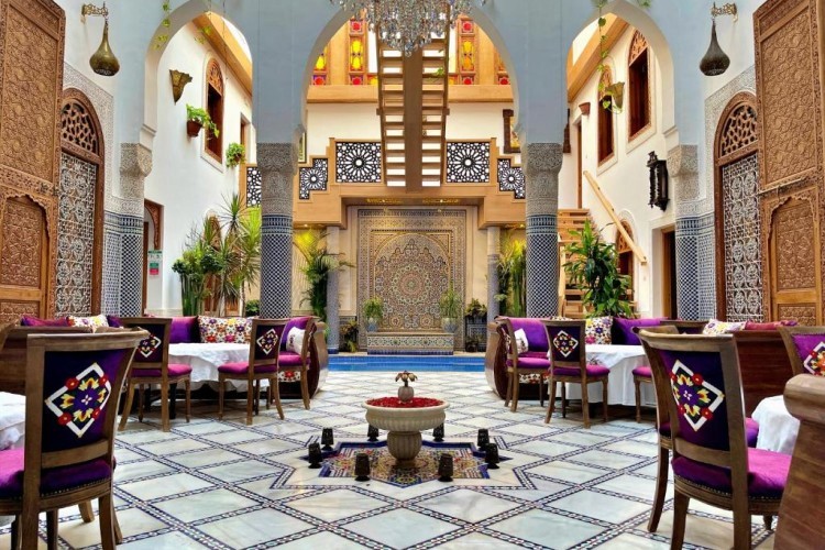 sunloungers fronting buildings near mountain