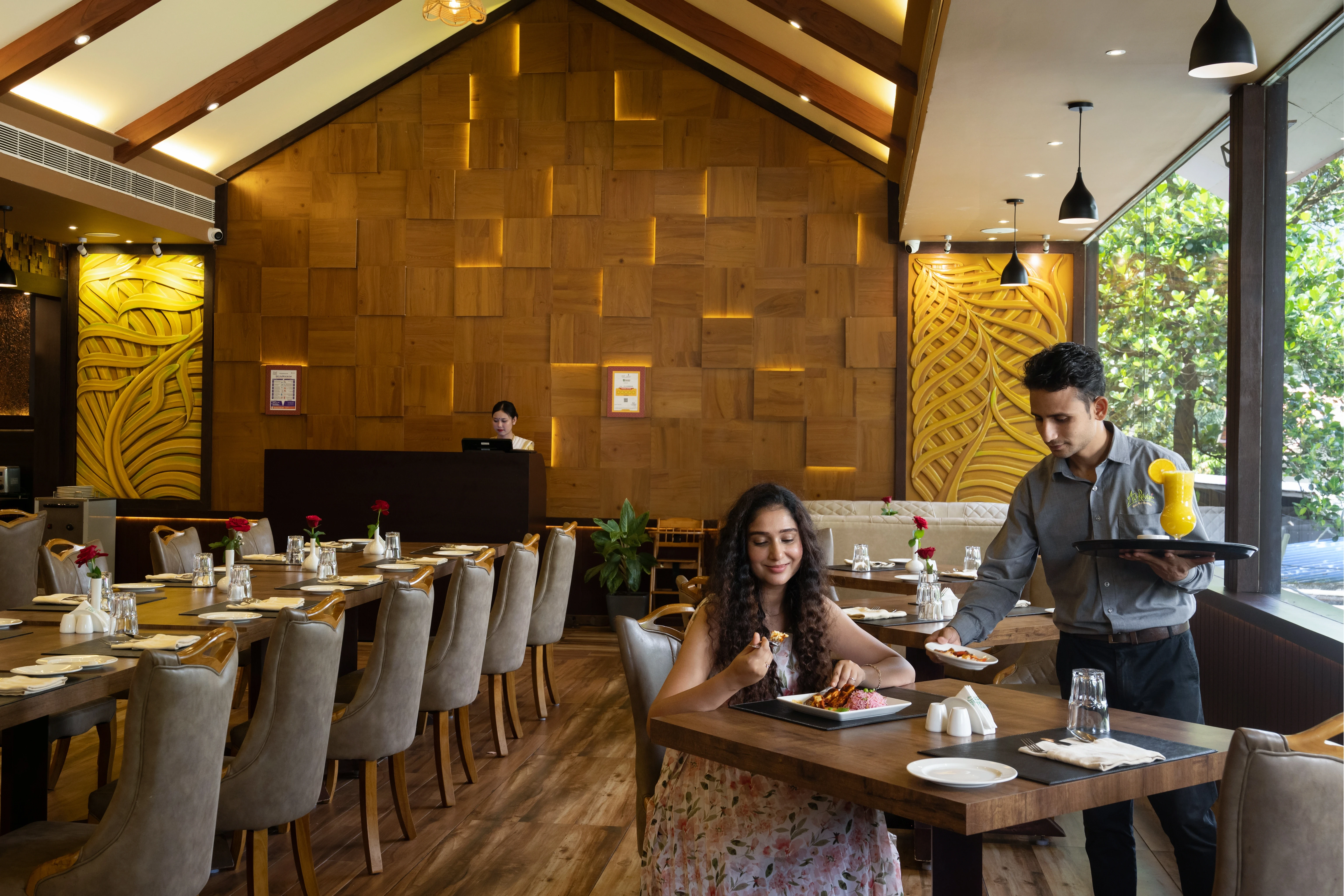 Belvoir fine dine restaurant exterior evening view in Palakkad with scenic hillside landscape, warm lights, and luxury ambience