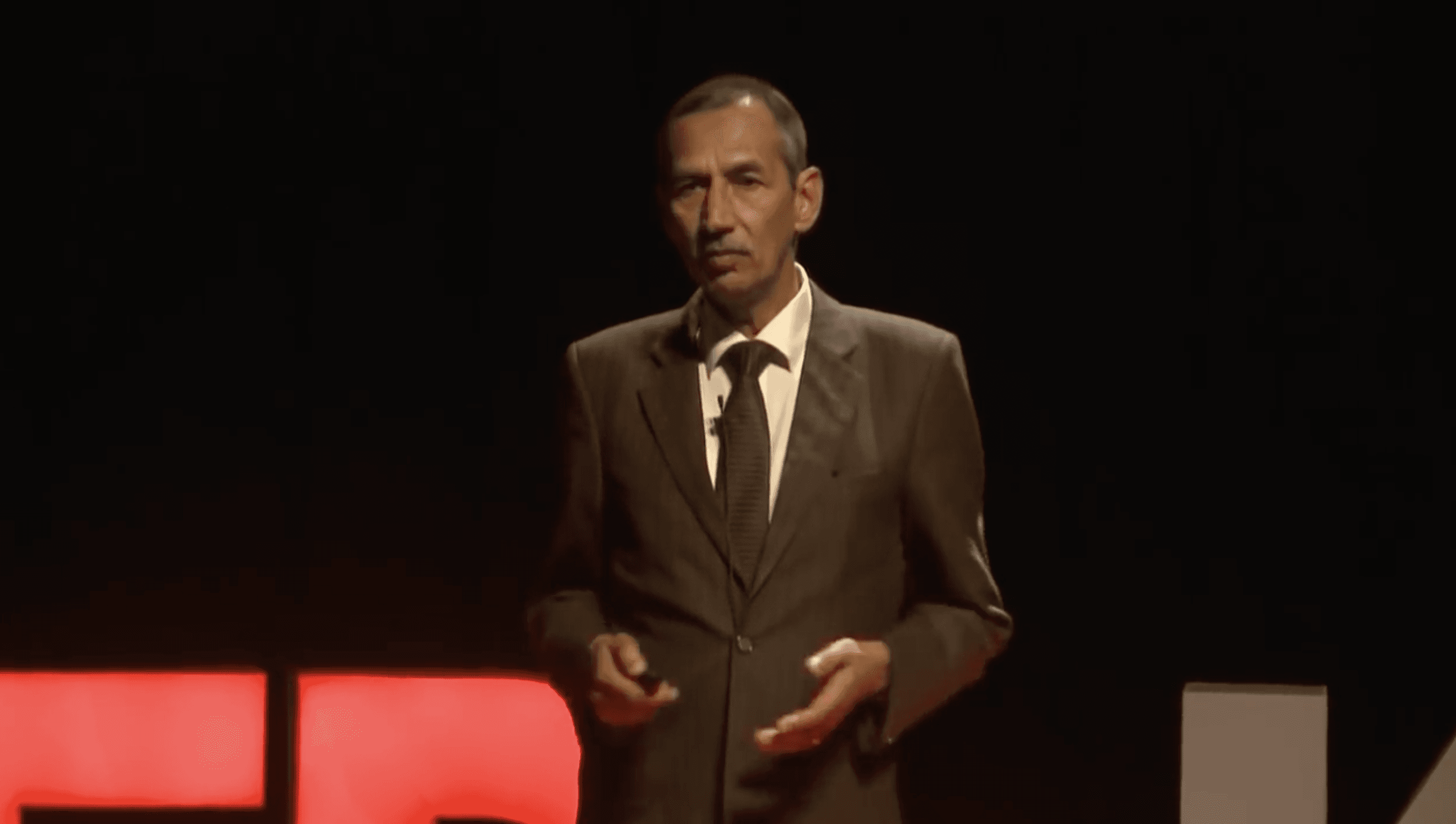 green wooden house on snow covered ground near green trees and mountain during daytime