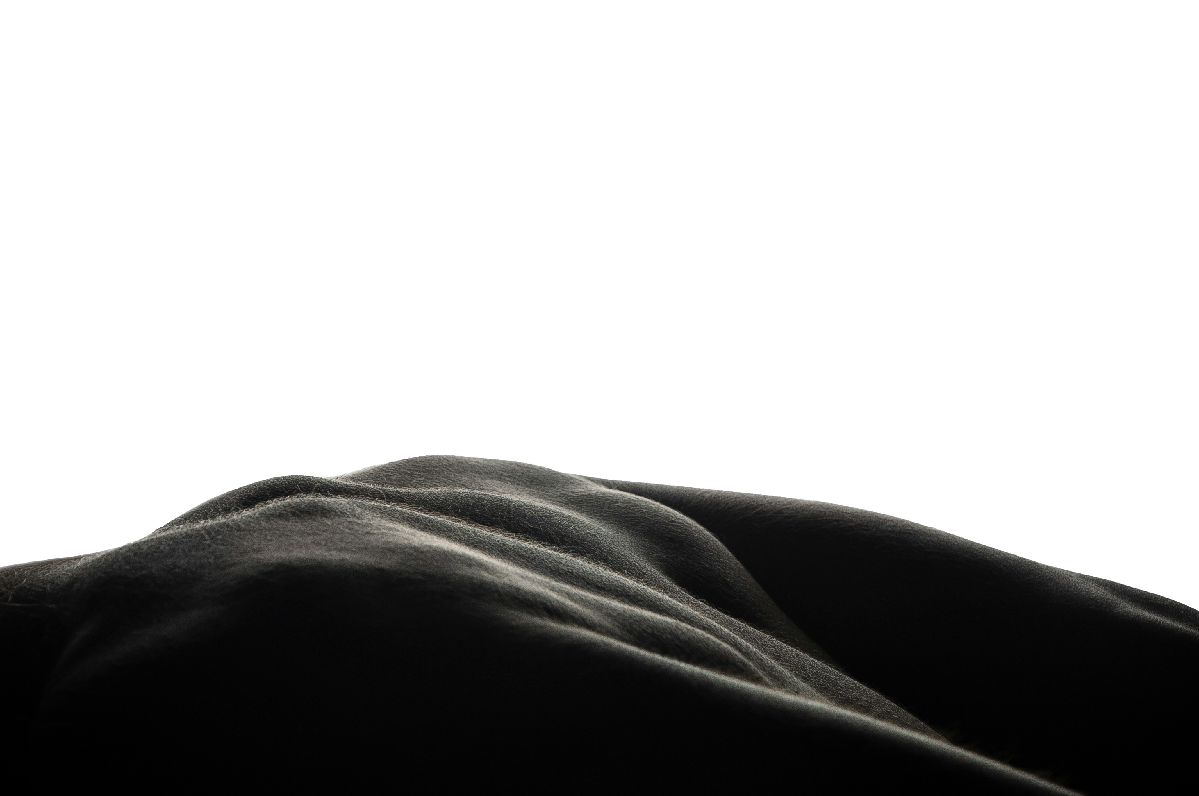 a person laying down with their head on a pillow