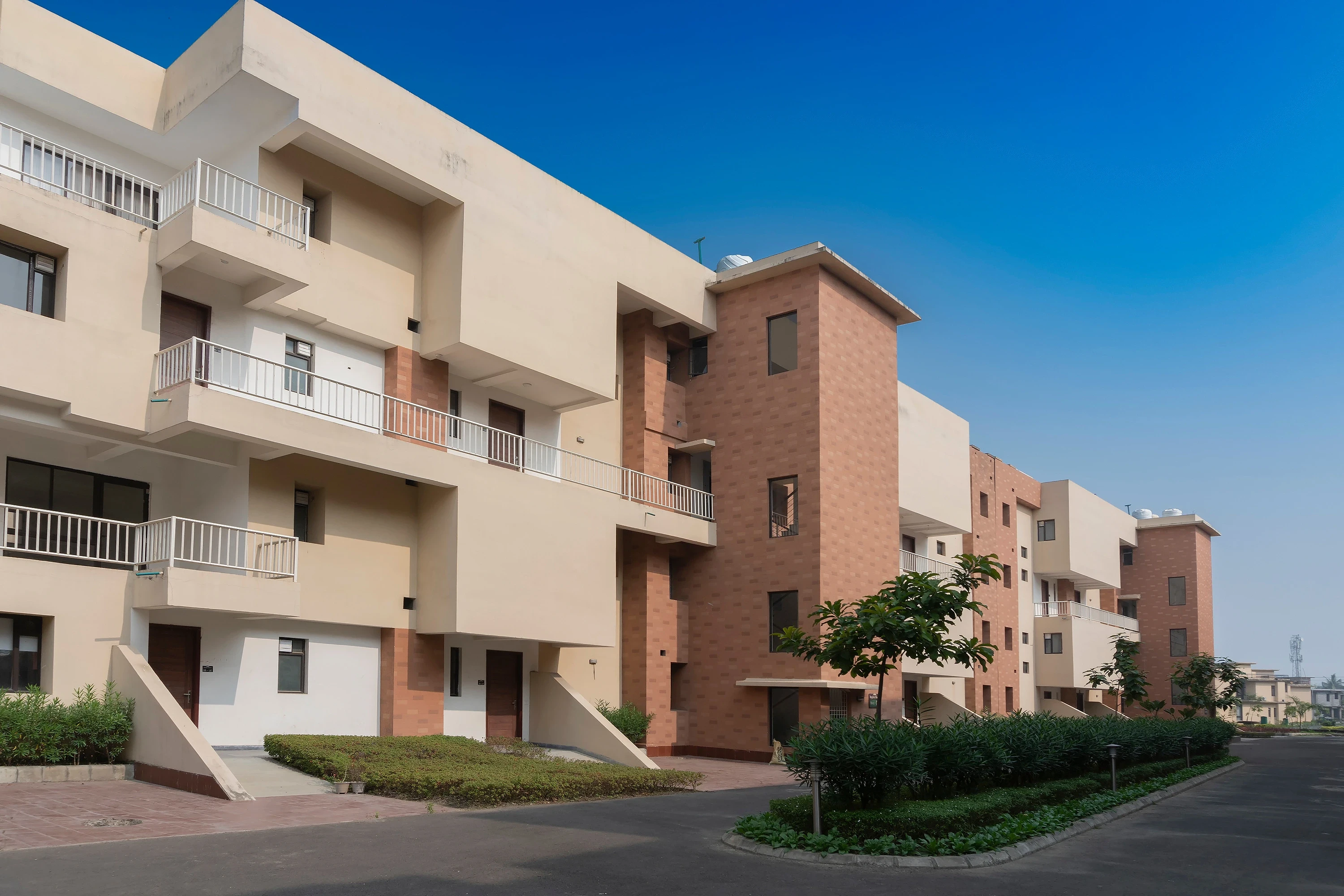 Multistorey buildings with balconies and landscaped paths