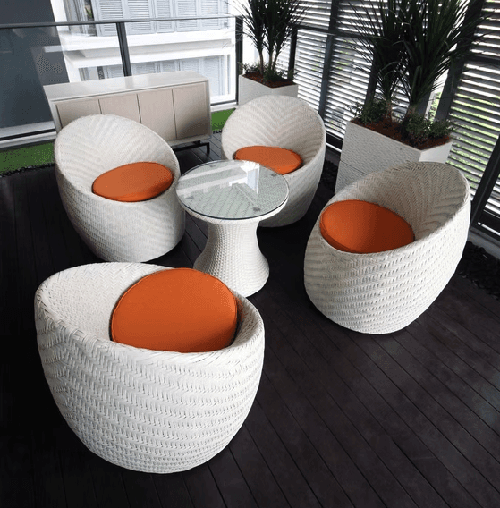 brown wooden chairs and table near glass window