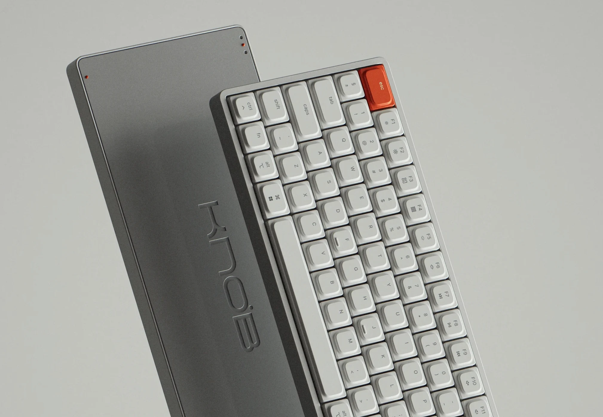Front and back view of silver and white keyboard