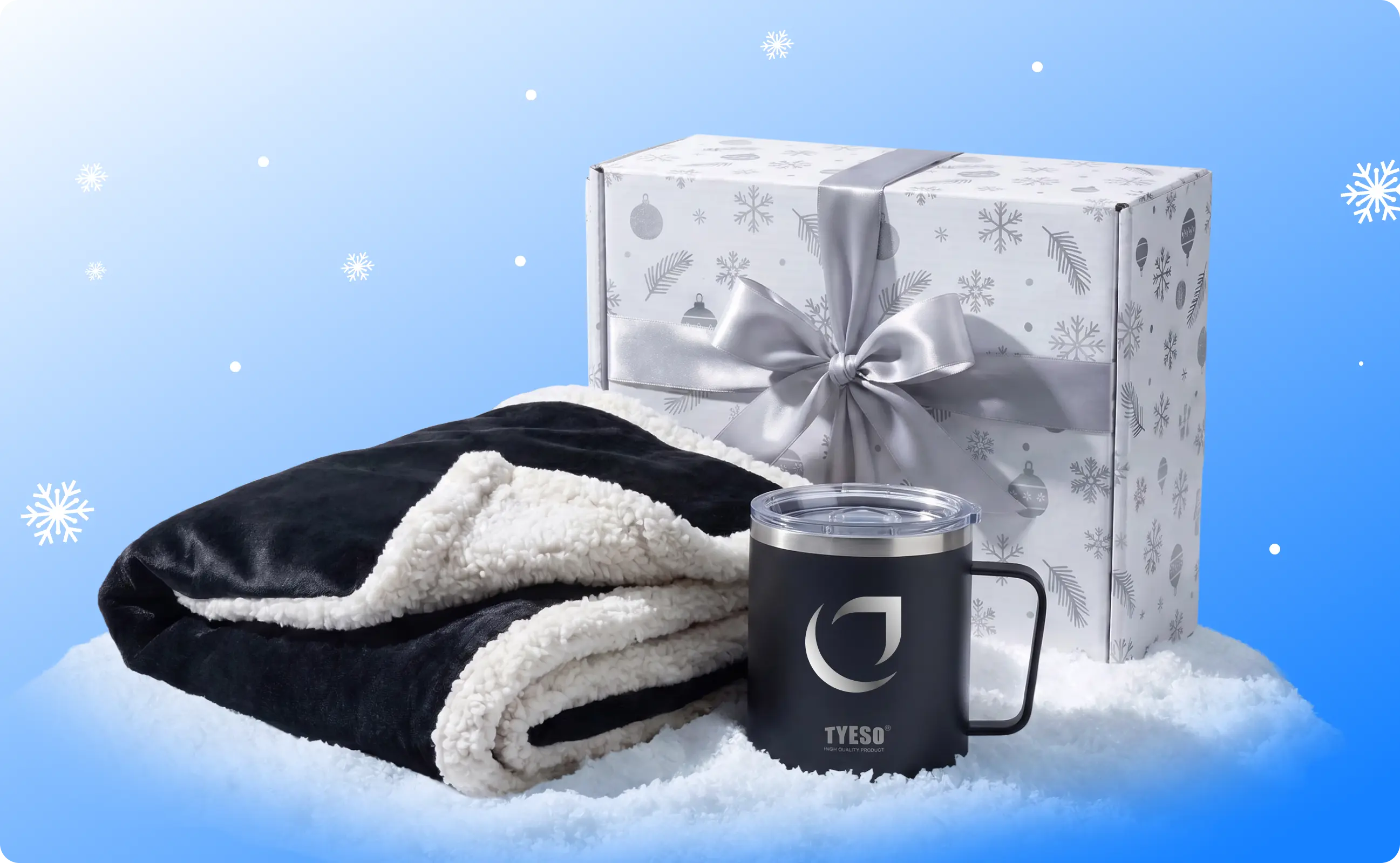 A blanket, an insulated mug, and a white box with a ribbon with a blue background.