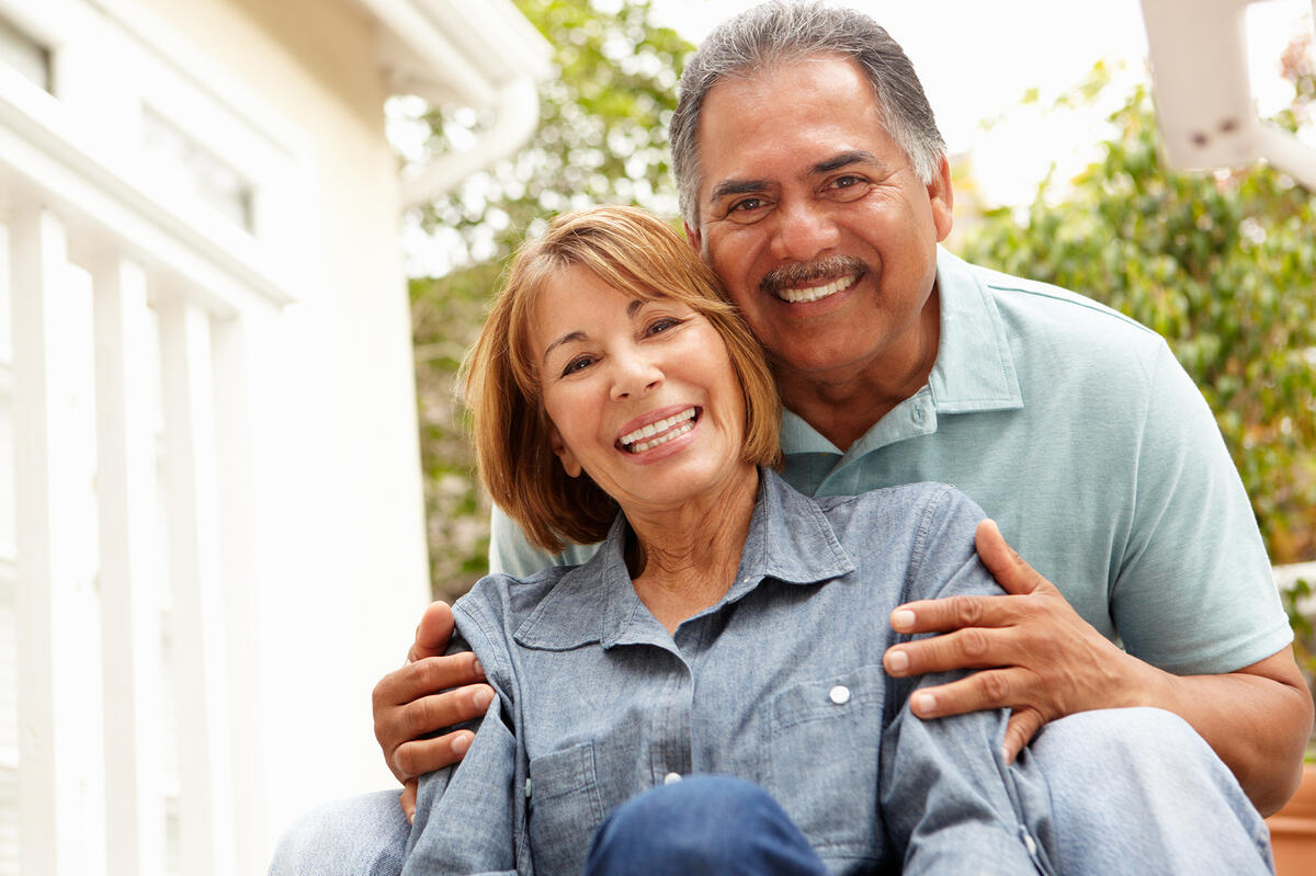 Middle-aged couple discussing annuities and financial security with We Insure Downtown Miami.