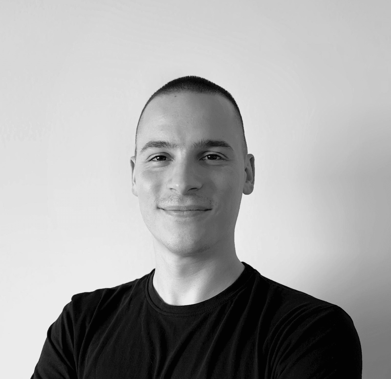 grayscale photography of man wearing crew-neck shirt