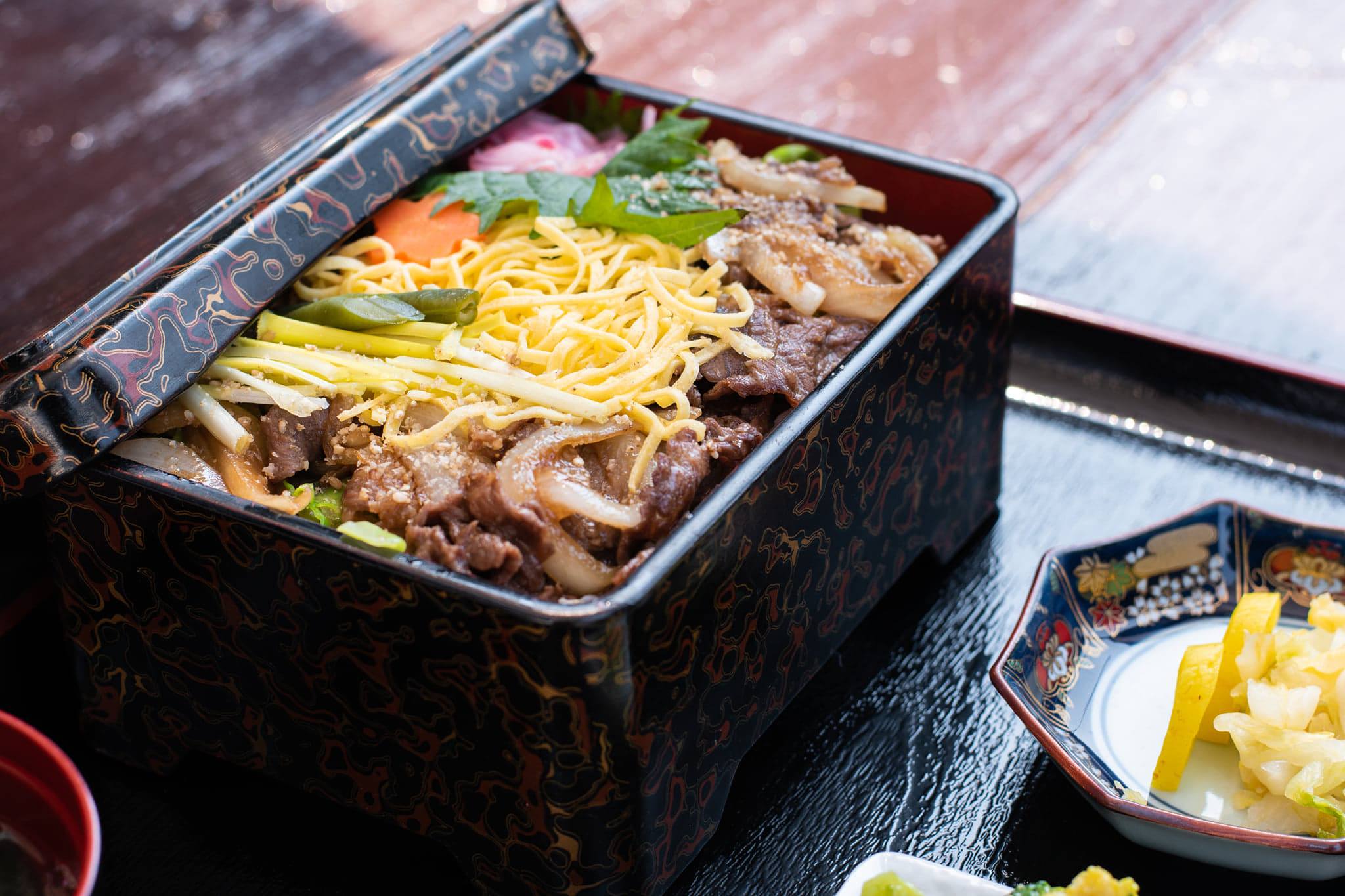 traditional Japanese dish in a bento box