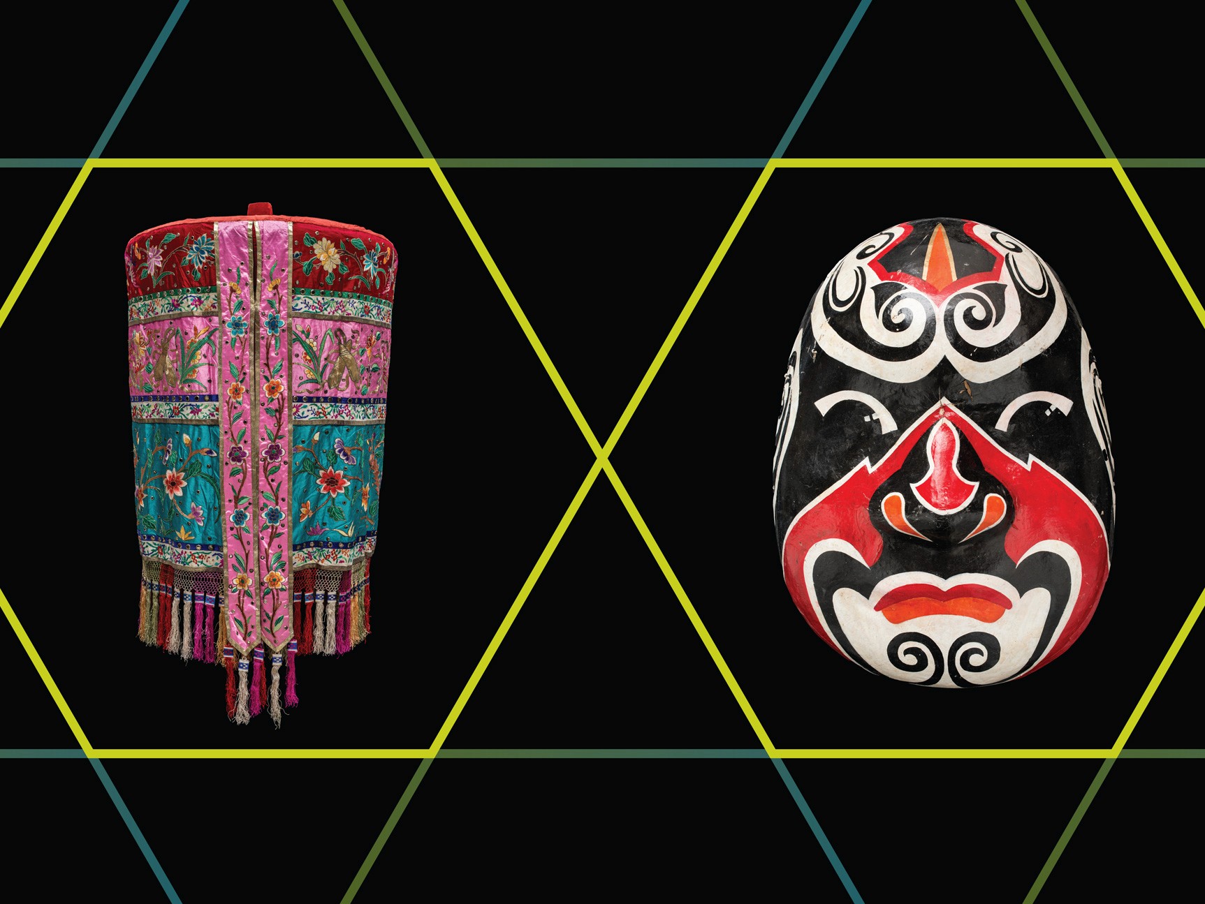 A cylindrical textile lantern and a black red and white mask on a black background