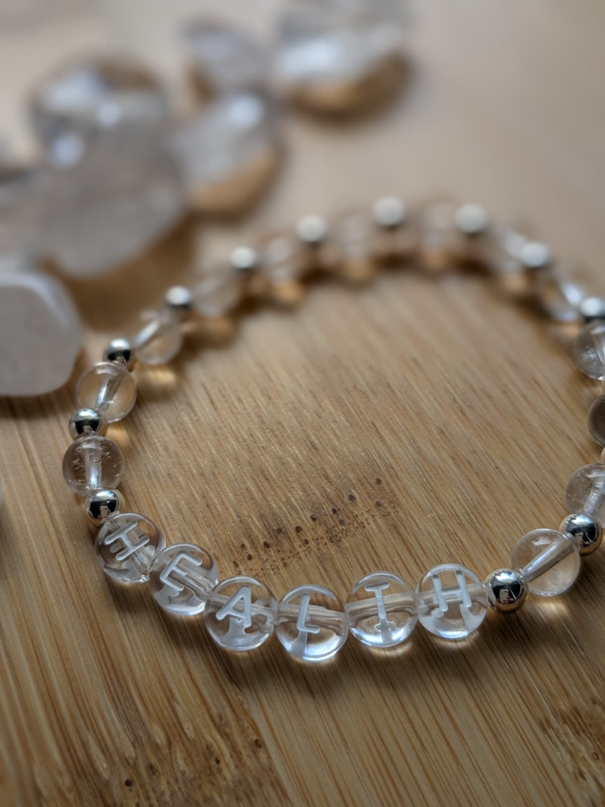 A woman lying on a massage bed, illuminated by soft sunlight streaming through a nearby window. A lush green plant in the background enhances the peaceful and rejuvenating ambiance.