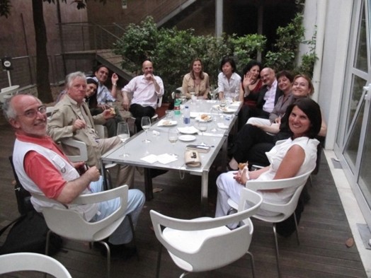 A group of people sitting at a restaurant table.