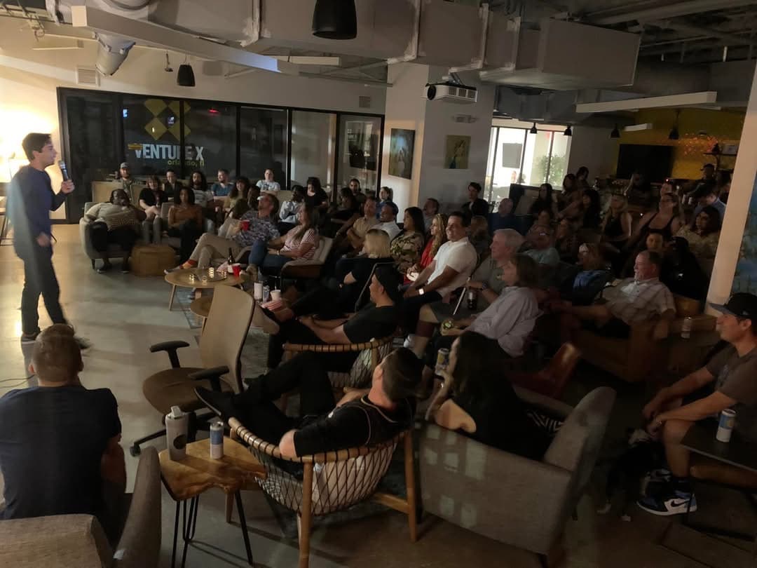 Vinny DiLorenzo Performing in front of a packed audience