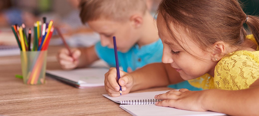 Students developing storytelling and creative writing skills in after school literacy enrichment program