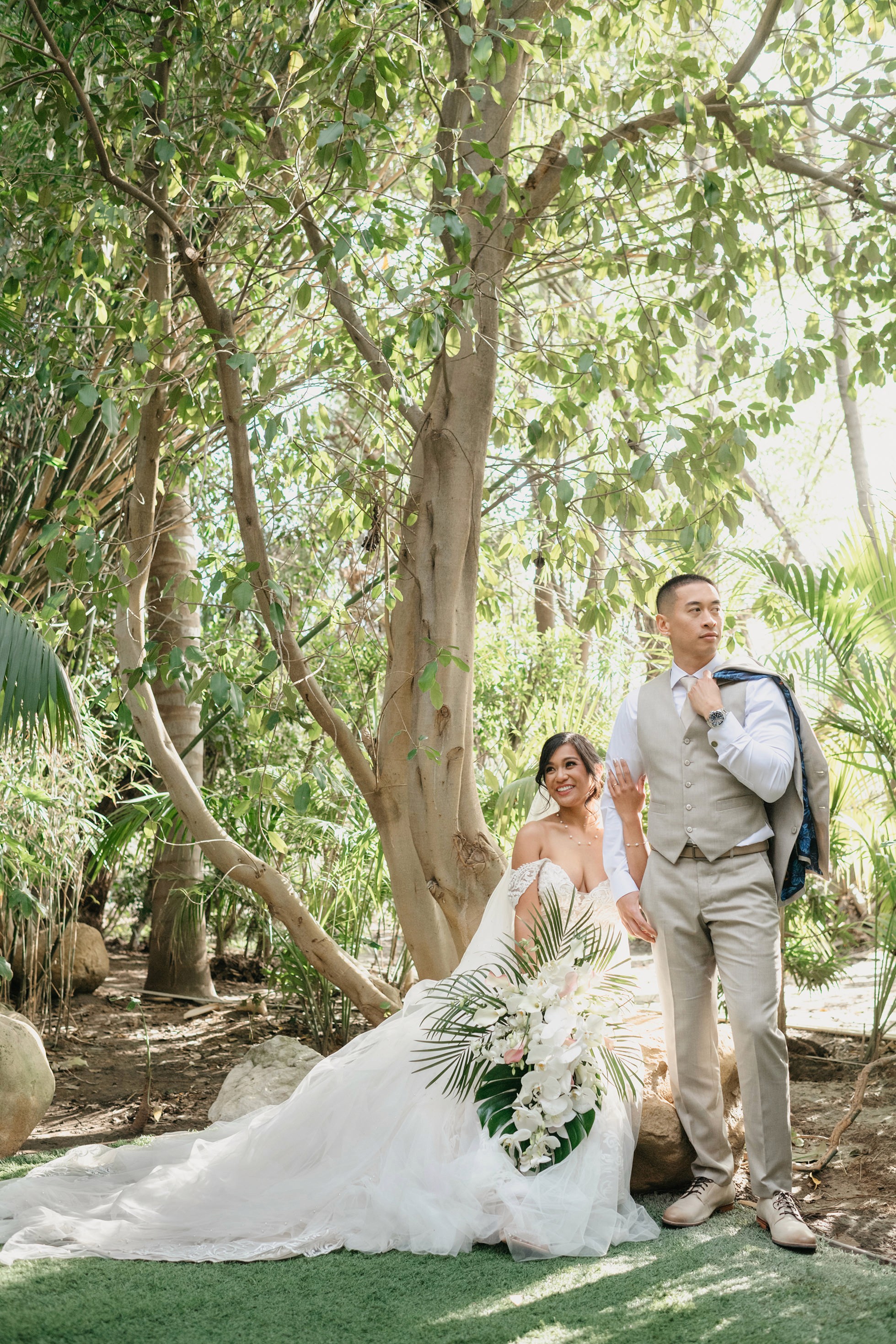 Romantic bride and groom portraits in lush greenery at Hartley Botanica